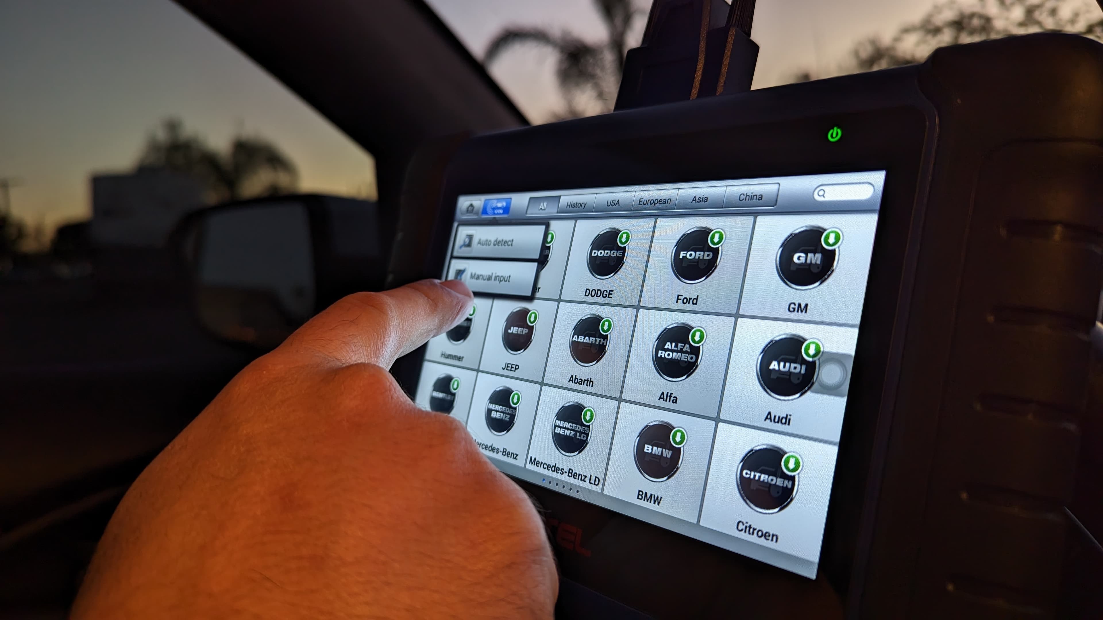 Key programming tablet showing vehicle manufacturer options